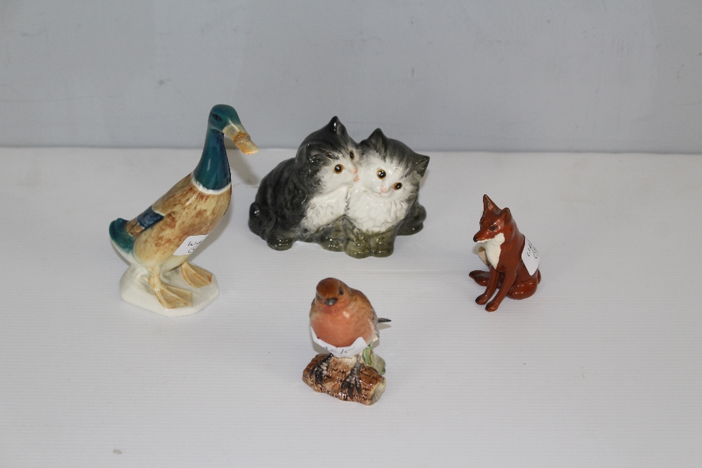 A group of four Beswick animal figures, Mallard Drake 736-2 (af) Two kittens 1316, seated fox 1746
