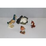 A group of four Beswick animal figures, Mallard Drake 736-2 (af) Two kittens 1316, seated fox 1746