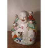 Chinese porcelain figure, Laughing Buddha with five children, 19cm high