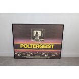 A framed 'Poltergeist' movie advertising poster, printed by W.E Berry Ltd, Bradford 79cm x 104cm