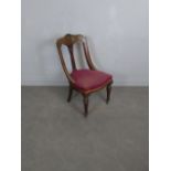 A late Victorian mahogany chair, with shell carved top-rail over a column form central splat and