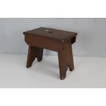 A small stained pine crocket stool or form 30cm x 32.5cm x 22.5cm