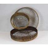 Three vintage bent-wood and wire mesh garden riddles, largest 54cm dia