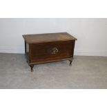An early 20th century stained elm blanket box, on squat cabriole legs AF some inlaid detail