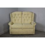 Two Seater cottage settee, with buttoned back and short wings, 107cm x 124cm