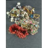 A small quantity of costume jewellery, including a stained coral bracelet, multi-strand bead collar,