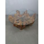 An impressive imported root-wood (New Zealand, possibly teak ) section coffee table with circular