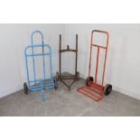 A vintage iron framed gas bottle trolley 94cm and two later examples 106cm