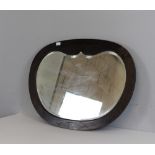 A mahogany oval mirror with shaped and bevelled plate 62cm x 83cm