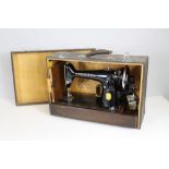 A cased singer sewing machine model number EG892328
