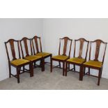 A set of six 1920's mahogany dining chairs, with yoke-form top rail and central splat with carved