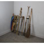 A quantity of walking sticks, parasols, and a broom (qty)