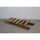 A vintage pine sledge with iron runners 122cm