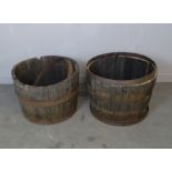 Two half barrel planters with iron bands 43cm x 65cm