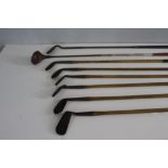 A group of six hickory shafted vintage golf clubs, including G Spalding Bros, Gold medal, and two