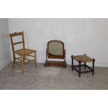 A Victorian mahogany swing toilet mirror 63cm high sold with a 1920's string seated stool (AF) and a