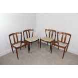 A group of four Danish teak dining chairs, marked 'Made in Denmark' to base, two retaining their