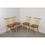 A set of four 1960's light Ercol stick back kitchen chairs 78cm high