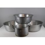 Three large aluminium mixing bowls 50cm dia and an aluminium two handled pan 29cm