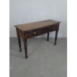 A Victorian pine side table, the planked rectangular top above a long frieze drawer with internal