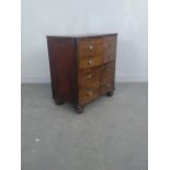 19th century mahogany four door cupboard, in the form of a chest of drawers, with turned feet 76cm x