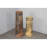 Two unglazed earthenware chimney pots, of cylindrical form 98cm & 75cm