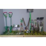 A quantity of gardening equipment, long handled bulb planters, hedge shears, midi forks, weeding