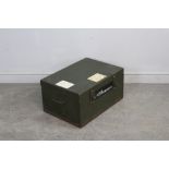 A World War II green-painted metal military trunk, impressed 'VAL 1944' with G.R.V.I cypher, piano