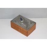 A pewter mounted hardwood jewellery/trinket box, by Sasha Bowles Designs, depicting a peacock