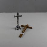 A chrome plated Corpus Christie 18cm and an Italian wood and moulded plastic Crucifix 22cm