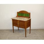 An Edwardian mahogany marble-topped washstand, with green tile inset splash back 113cm x 84cm x