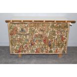 A machined tapestry wall hanging, depicting a medieval scene. with square section oak pole hanger