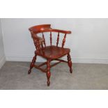 A Victorian stained-elm captains armchair, of traditional form, reduced in height 75cm