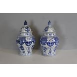 Pair of modern blue and white pottery baluster shaped vases and covers of Chinese design 86cm