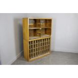 A vintage bank of filing shelves/pigeon holes 77cm x 105cm x 37cm together with a vintage laminate