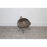 A cast-iron oval fire basket with deep well and raised back, on shaped legs 41cm x 48cm