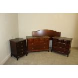 A Stag Minstrel four-piece bedroom suite, comprising headboard, bedside chest and two chests of