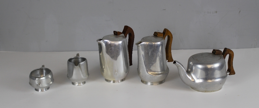 A Picquot ware four-piece teaset and near matching hotwater pot (5)