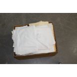 A box of various mixed linen, table cloths, sheets etc