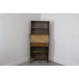 An Arts and Crafts oak bureau bookcase, of slender proportions, AF. 148cm high x 71cm wide x 25cm