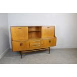 A 1970's G-Plan teak sideboard 122cm x 187cm x 46cm