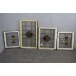 Four stained and leaded glass windows, early 20th-/mid 20th century. The largest measuring 82cm x