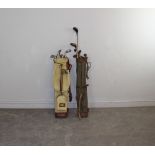 Two vintage leather and canvas golf bags and a selection of various hickory and metal shafted golf
