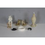 A pair of 1930's alabaster book-ends, an alabaster baluster table lamp, two Egyptian soapstone