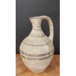 Roman pottery jug, decorated with brown banding and a star, 22cm high