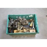 A box of various tools, block plane, metal woodworking planes, moulding plane, rasp, log splitting