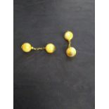 A pair of butterscotch amber and gilt metal cuff-links 3grams gross