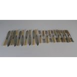 An uncased and incomplete set of electro-plated fish cutlery (JE&SS) with ivory style handles and