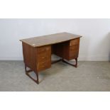 A 1970's style teak dressing table with associated bowed and inlaid top 73cm x 116cm 55.5cm