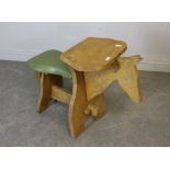 A vintage elm child's seat/table in the form of a horse, with padded seat 71cm x 90cm watermarks,